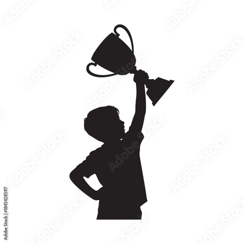 A silhouette of a young boy raising a trophy in victory