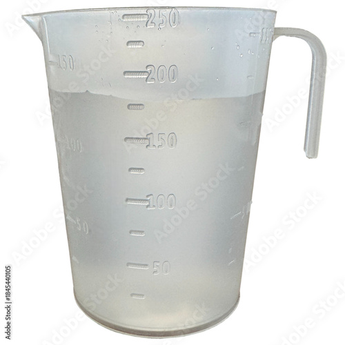 Transparent plastic measuring cup filled with water isolated on white background. Kitchen container with volume scale markings. Clean cutout for cooking, baking, and recipe concepts.
