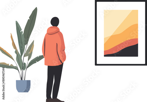 Person viewing modern abstract art in a frame next to a potted houseplant with large green leaves in a minimalist setting