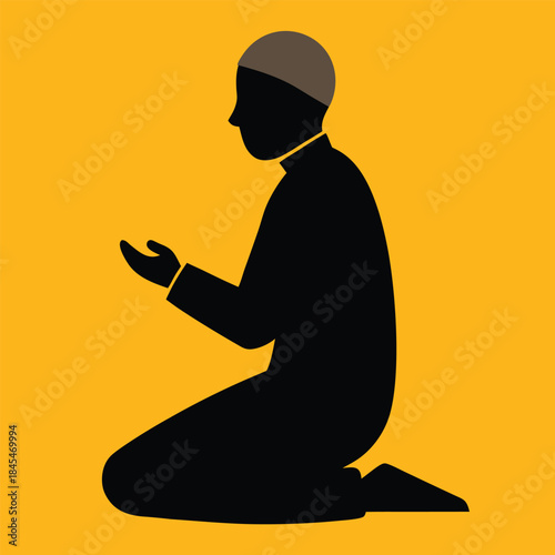 silhouette of a man meditating on the beach