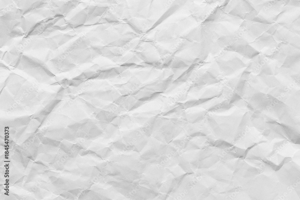 Naklejka premium Close-up macro view of a wrinkled white paper surface,Macro white crumpled paper background,White crumpled paper texture background.