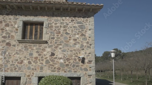 Old stone house Polecam jib windows mountain Sant Llorenc pan right 1