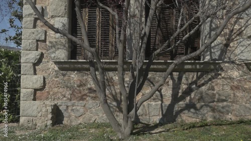 Tree branches old stone house Polecam jib windows up 3