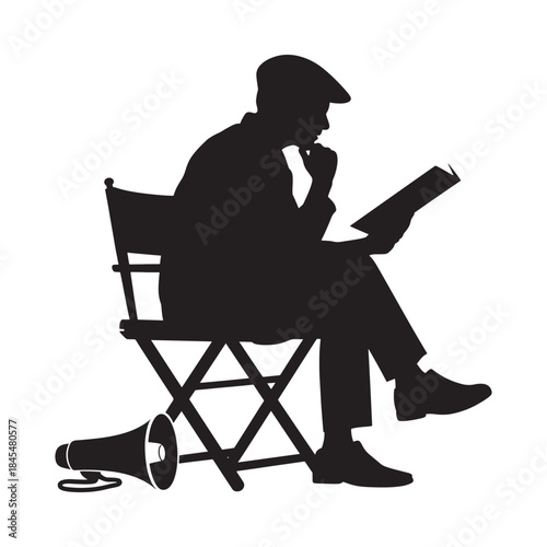 A silhouette of a man reading a book while seated in a director s chair