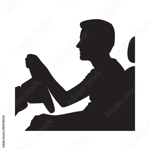 Silhouette of a man driving a car viewed from the side