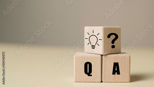 Wooden blocks with Q&A, question mark, and light bulb icon representing FAQ and problem-solving concept. Ideal for customer support, consulting, or educational content.