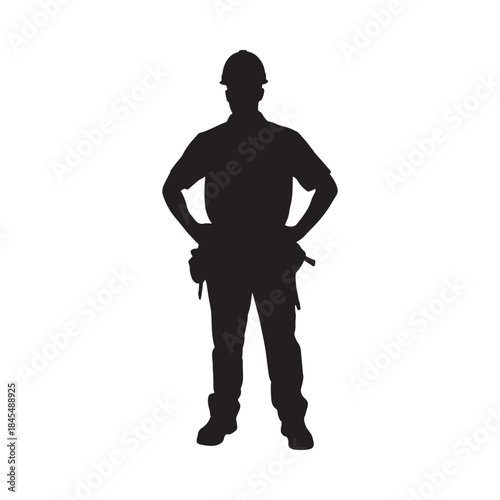 Silhouette of a construction worker standing with hands on hips isolated