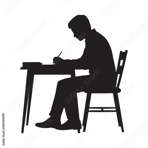 Silhouette of a man seated at a desk writing or studying intently