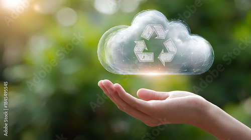 Hand holding digital cloud with recycling symbol against green blurred background technology