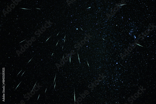 Geminids meteor shower streaks across a clear starry night sky