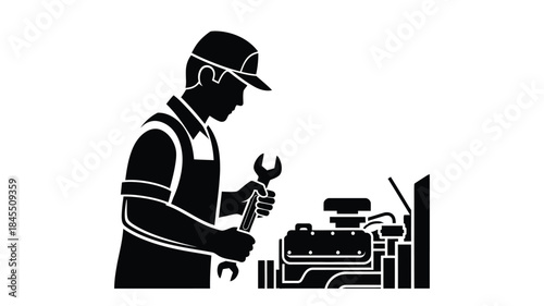 Mechanic working on car engine repair a striking black silhouette