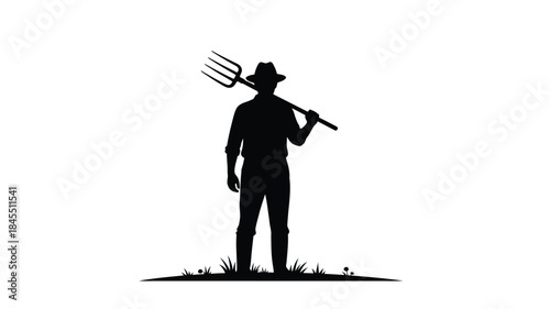 A farmer stands with a pitchfork over his shoulder a striking silhouette