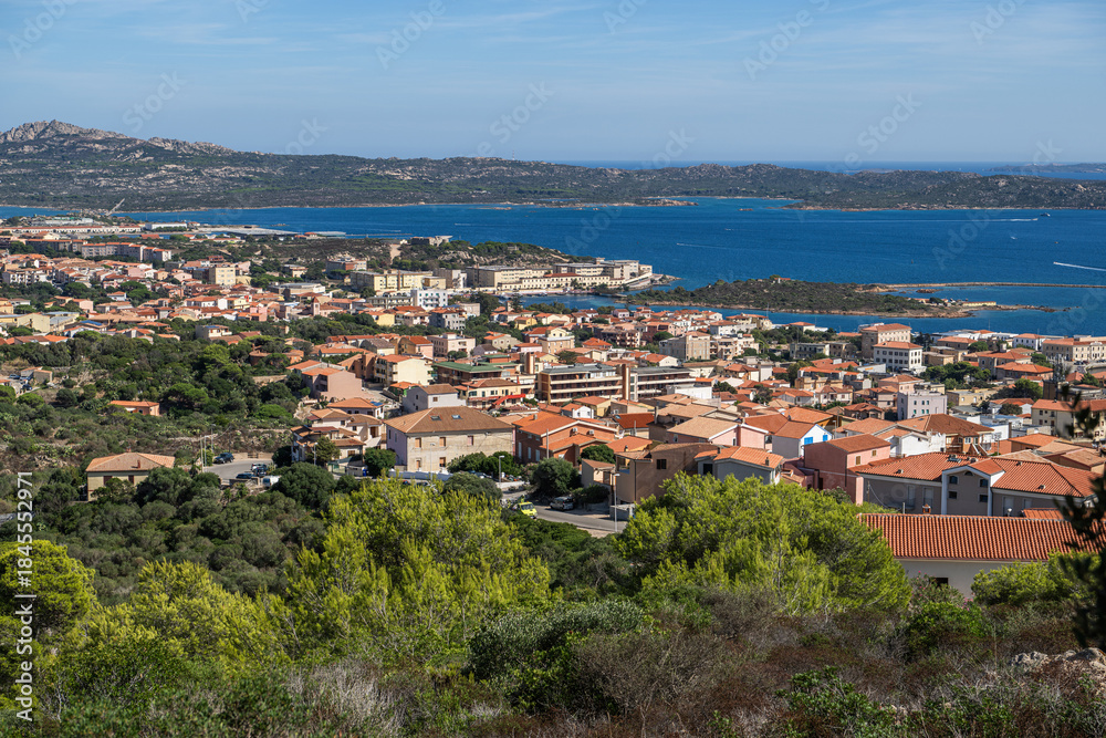 Fototapeta premium La Maddalena, Sardinia. View of a Coastal Town Near the Sea on a Clear Day