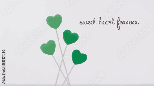 Four green heart shaped lollipops on sticks with sweet heart forever text on a white background