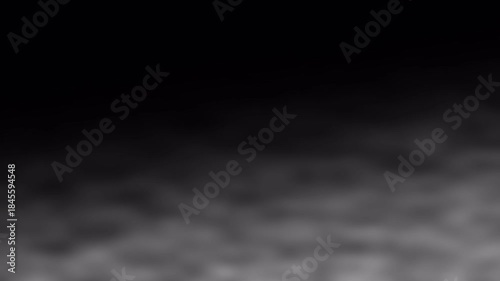 Realistic low ground fog overlay with spooky white creeping smoke mist atmosphere on black.