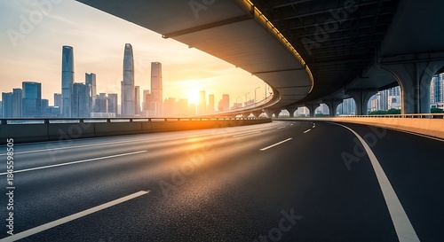Modern city highway at sunset with a dynamic curve leading towards a vibrant urban skyline
