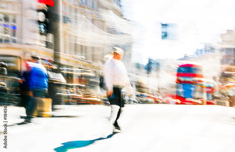 Obraz premium Postmodernism style, artistic motion of people crossing Oxford Circus junction at sunny day. British double decker buses at the background. London