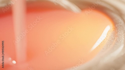 Pouring Liquid on Fabric - A Close-Up of Stain Removal.