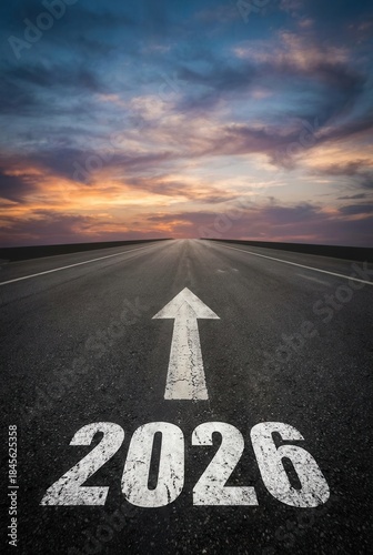 Road Ahead to Year 2026 with Arrow on Asphalt at Sunset.