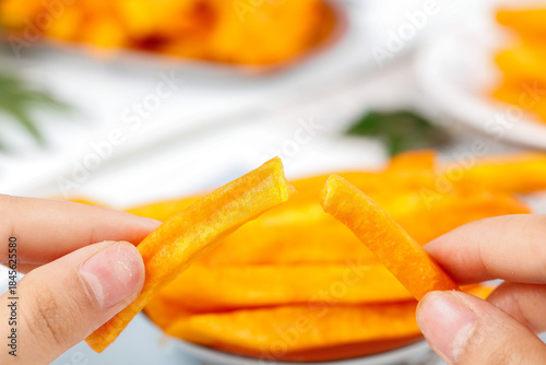 Hand Holding Crispy Roasted Groundnut Snack Bars