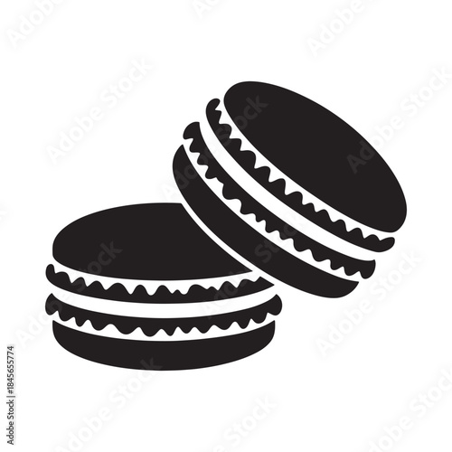 Two black and white macarons a sweet treat in a simple design