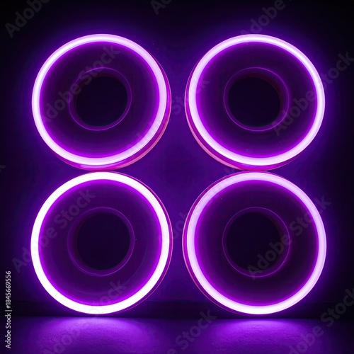 Four glowing, purple donut-shaped lights in a square arrangement, dark background