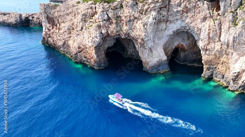 Aerial drone cinematic video of paradise fjord shaped bay and exotic caves of Korakonisi, Zakinthnos island, Ionian, Greece