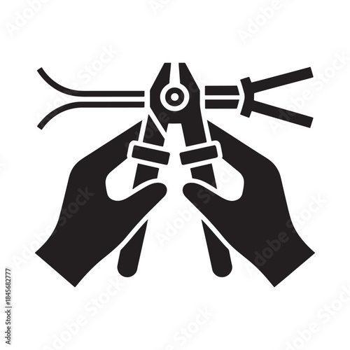 Hands using pliers to cut or manipulate electrical wires a repair tool