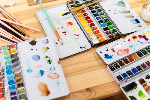 Watercolor painting workshop with art supplies and brushes