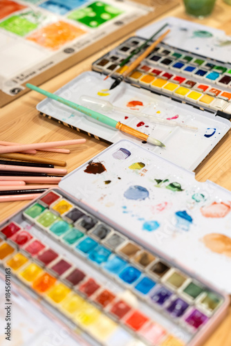 Watercolor workshop creating artwork with paintbrushes and palette