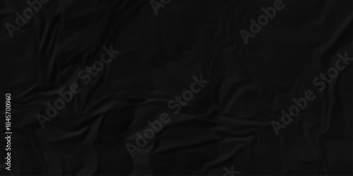 Crumple crushed black paper obsolete rumple craft design. wrinkle ripped creased crumple aged closeup recycled document grunge paper background.