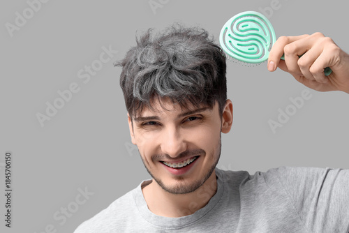 Young man with graying hair...