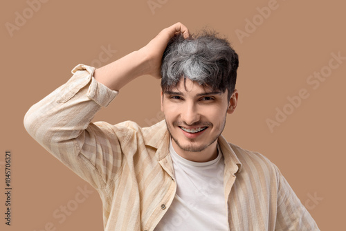 Young man with graying hair...