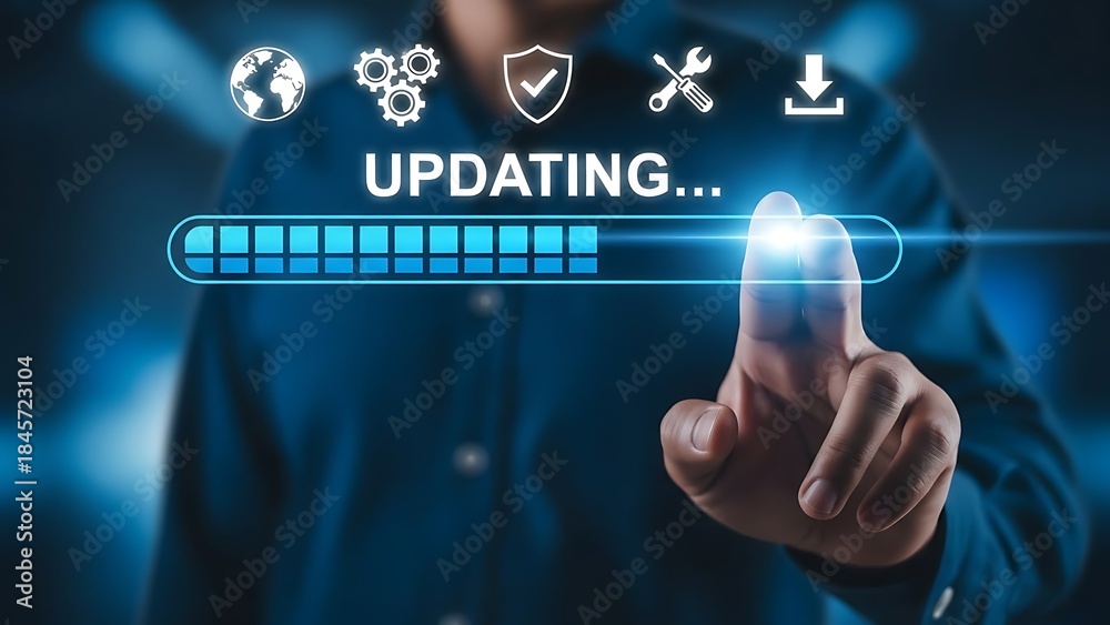 Obraz premium Finger touching a screen to begin a system update and software maintenance procedure