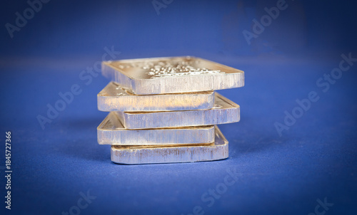 View of precious metal silver bars on blue banner