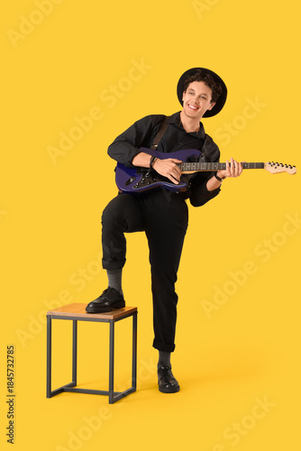Young happy man playing new...