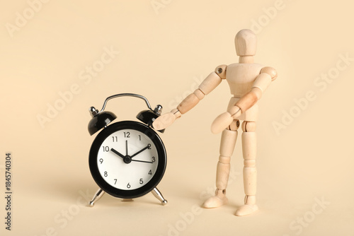 Wooden mannequin with alarm...