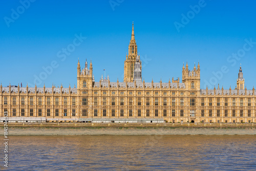 London, England, UK: Waterfront view of the House of Parliament building on the banks of river Thanes