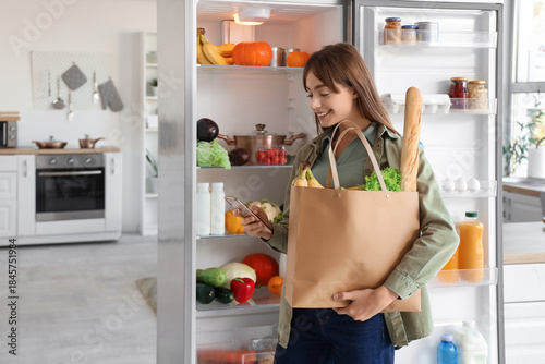 Young woman with bag of foo...