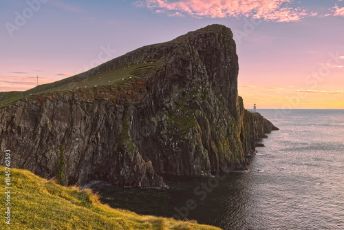 The 122m high An t-Aigeach (Stallion Head) crag and the Neist Point lighthouse, at early sunset from the Duirinish Peninsula cliffs. Skye-Scotland-151