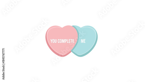 Two conversation hearts with you complete me text on white background, sweet valentine's day concept with pink and blue candy hearts
