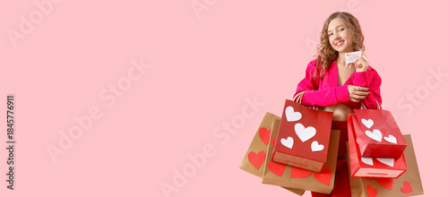 Young woman with gift card ...