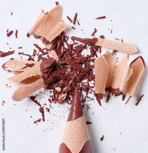Tableau sur toile Wooden brown shavings of lead pencil on white background