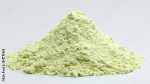 Light green powder pile isolated on white background