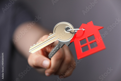 A person holding a house ke...