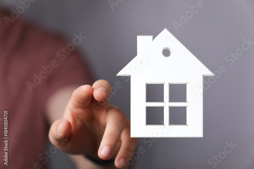 Person's hand pointing towa...
