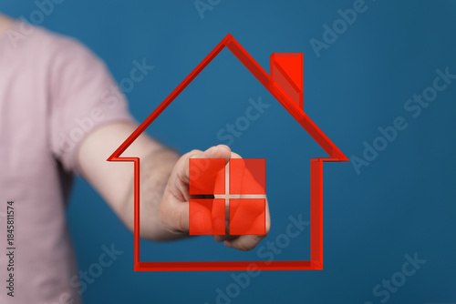 A person's hand holding a r...