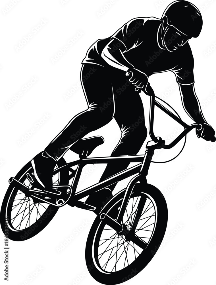 Fototapeta premium Silhouette of aBMX cyclist performing a trick on a bicycle with a helmet bike