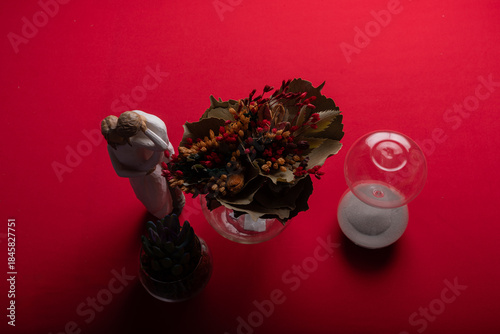 Minimal floral arrangement on red surface