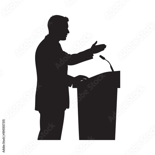 Confident public speaker presenting at podium in silhouette